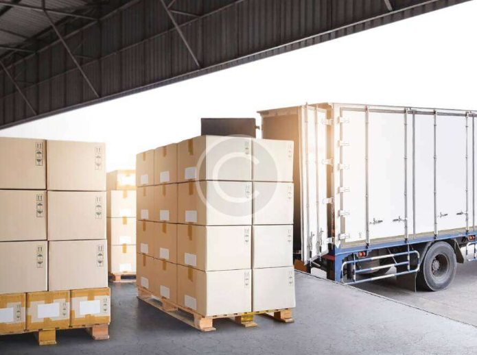 Palletized boxes staged at a dock for last‑mile deliveries