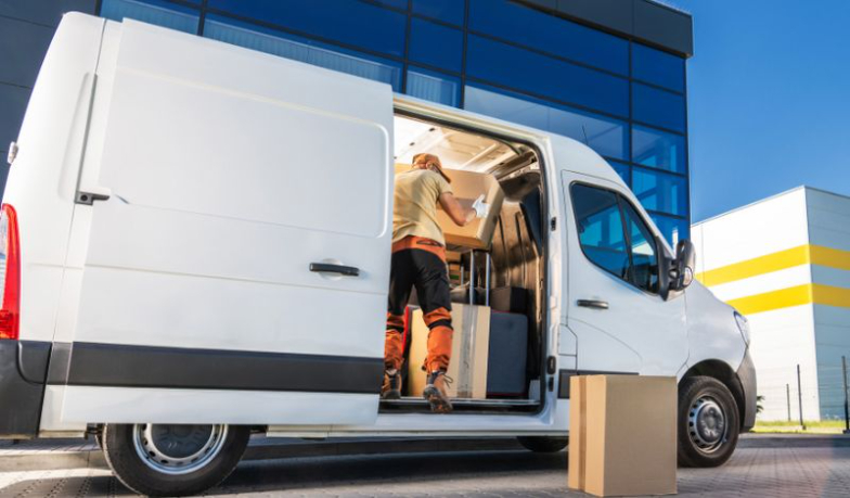 High-roof van staged at a warehouse dock